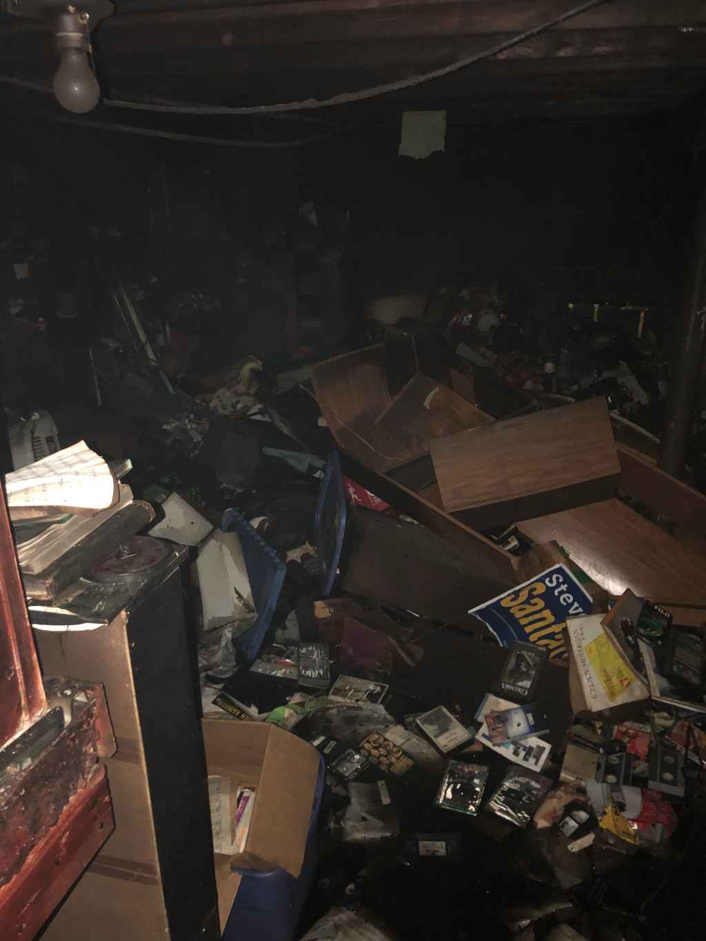 Fire-damaged room before Priority Restoration's cleanup